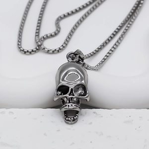Detail shot of gothic skull pendant with vintage silver finish and box chain