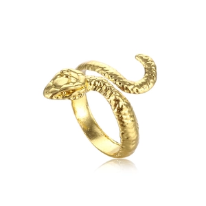 Macro shot of gold snake ring with realistic scale textures and coiled design