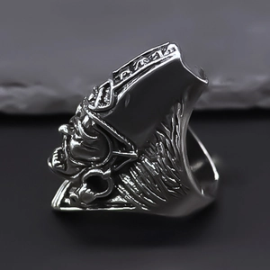Close-up of vintage warrior ring showing intricate feather headdress and matte metal texture