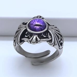 Vintage gothic evil eye ring in silver with purple gemstone and wings detailing