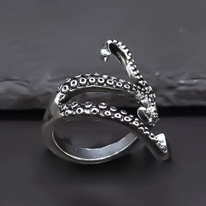 Retro silver octopus tentacle spiral ring with detailed suckers in a gothic street style