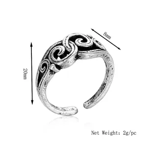 Vintage oxidized silver open ring with embossed scroll patterns and 20mm height scale