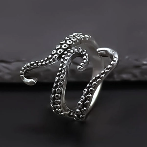 Macro shot of antique silver octopus tentacle ring with detailed suction cup texture