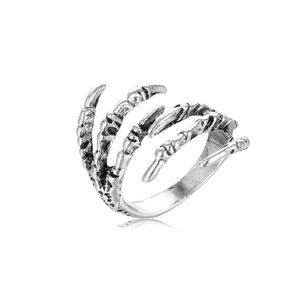 Macro detail of silver punk bone claw ring with vintage oxidized finish and intricate texture