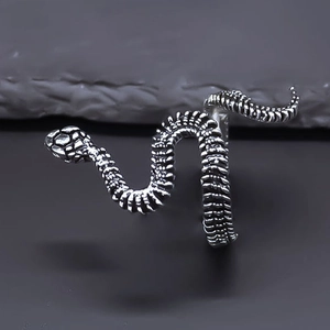 Close-up of vintage silver snake ring with detailed scales and spiral wrap design