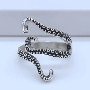 Detailed view of retro octopus tentacle silver ring with oxidized sucker texture