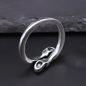 Macro shot of liquid silver style adjustable ring with irregular metallic surface detail