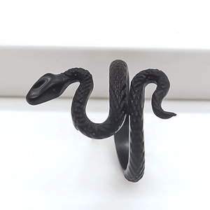 Retro black alloy snake ring with detailed scale engraving in a wrap-around gothic style