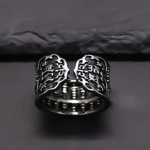 Close-up of vintage alloy abacus ring featuring embossed traditional cloud patterns