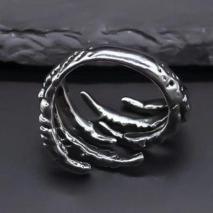 Macro shot of punk claw open ring showing vintage silver metal texture and rugged details