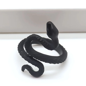 Detailed view of matte black snake ring showing intricate scale textures and Gothic style