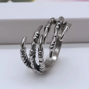 Gothic punk dragon claw ring in vintage silver finish with detailed bone texture