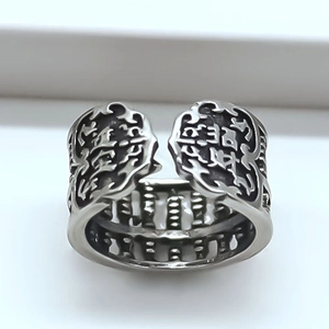 Macro shot of silver vintage abacus ring with Lucky Wealth engraving and adjustable band