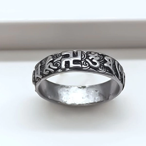 Retro distressed metal ring with sacred symbols and intricate vintage scroll patterns