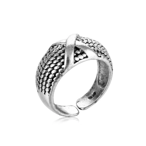 Close-up of vintage S925 silver ring with crossover X design and beaded texture detail