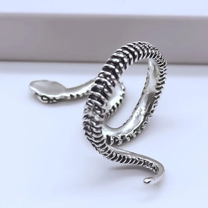 Oxidized silver snake-shaped open ring with intricate scale textures and retro finish