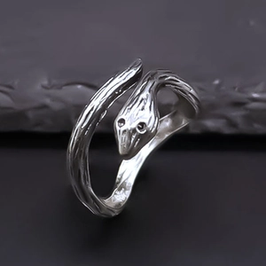 Macro detail showing the lifelike bionic texture of the vintage silver snake ring