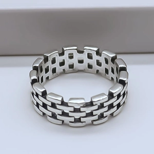 Detailed macro view of the silver vintage ring featuring an industrial brick pattern