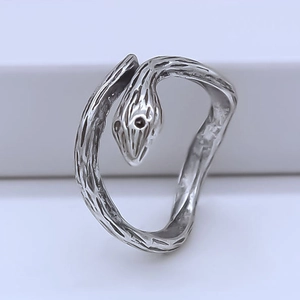 Close-up of vintage silver snake ring featuring realistic scale texture and gothic design