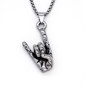 Detailed view of hip-hop rock hand gesture pendant with vintage textured metal finish