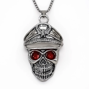 Vintage punk skull pendant necklace with military hat and red gem eyes on white background
