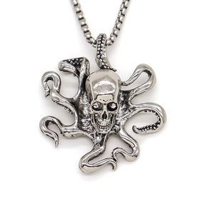 Close-up of vintage punk Cthulhu skull pendant with detailed octopus tentacles and box chain