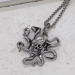 Macro detail of gothic octopus skull pendant with vintage oxidized metal texture