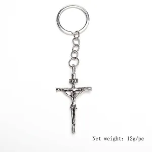 Silver alloy cross pendant keychain with dimensions 32x119mm shown on white background