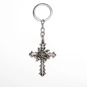 Vintage Gothic silver metal keychain featuring a rose-centered cross and detailed carvings