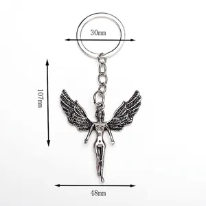 Silver alloy angel wing keychain pendant for backpacks with vintage engraved details