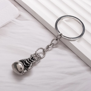 Minimalist alloy boxing glove keychain with vintage silver finish and sporty aesthetic