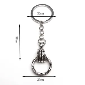 Vintage gothic skull hand keychain with circle pendant in retro silver finish for men