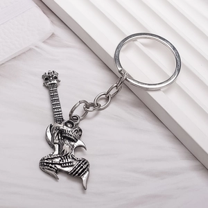 Retro rock skull guitar keychain made of silver metal for men music fans and bikers