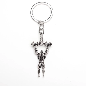 Detailed view of silver muscle man charm lifting a barbell on a metal keychain