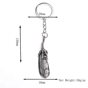 Vintage eagle claw feather alloy keychain accessory with a minimalist white background