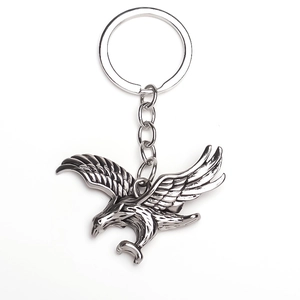 Detail of vintage silver eagle keychain with detailed wing textures and circular ring