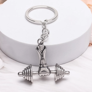 Vintage silver metal keychain featuring weightlifting arm with dumbbell for fitness lovers