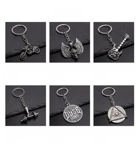 Collection of vintage alloy keychains featuring motorcycle, guitar and skull designs
