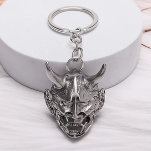 Retro silver alloy Hannya mask keychain with creative horned design and metal ring
