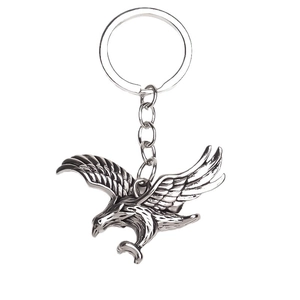 Vintage silver eagle keychain featuring detailed eagle wings in a diving posture