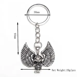 Punk skeleton skull with wings metal keychain with detailed dimensions on white background