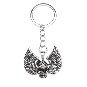 Retro punk skull with detailed feather wings keychain in vintage silver finish