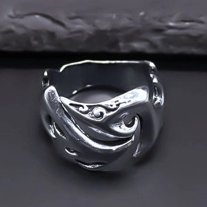 Exaggerated silver vintage alloy ring featuring flame-like textures and a punk aesthetic