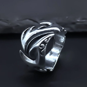Detailed macro view of the intricate flame carving on this punk style silver alloy ring