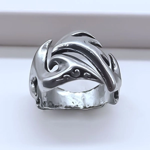 Vintage silver wide band ring with embossed flame patterns and punk aesthetic style