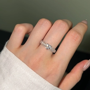 Close-up of S925 silver ring featuring a heart-shaped zircon and pavé diamond band