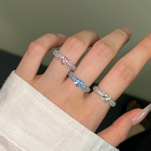 Detailed view of three S925 sterling silver rings with colorful heart shaped zircon stones
