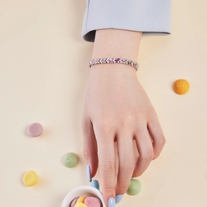 Detail of colorful chevron S925 sterling silver bracelet with multi-colored zircons