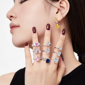 Close-up of elegant S925 silver rings with colorful ice-cut cubic zirconia on model's hand