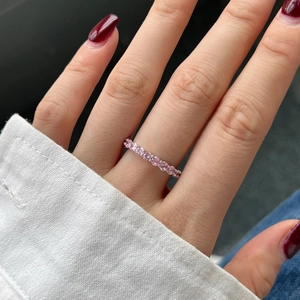 Detail of S925 sterling silver eternity band ring featuring pink 5A cubic zirconia